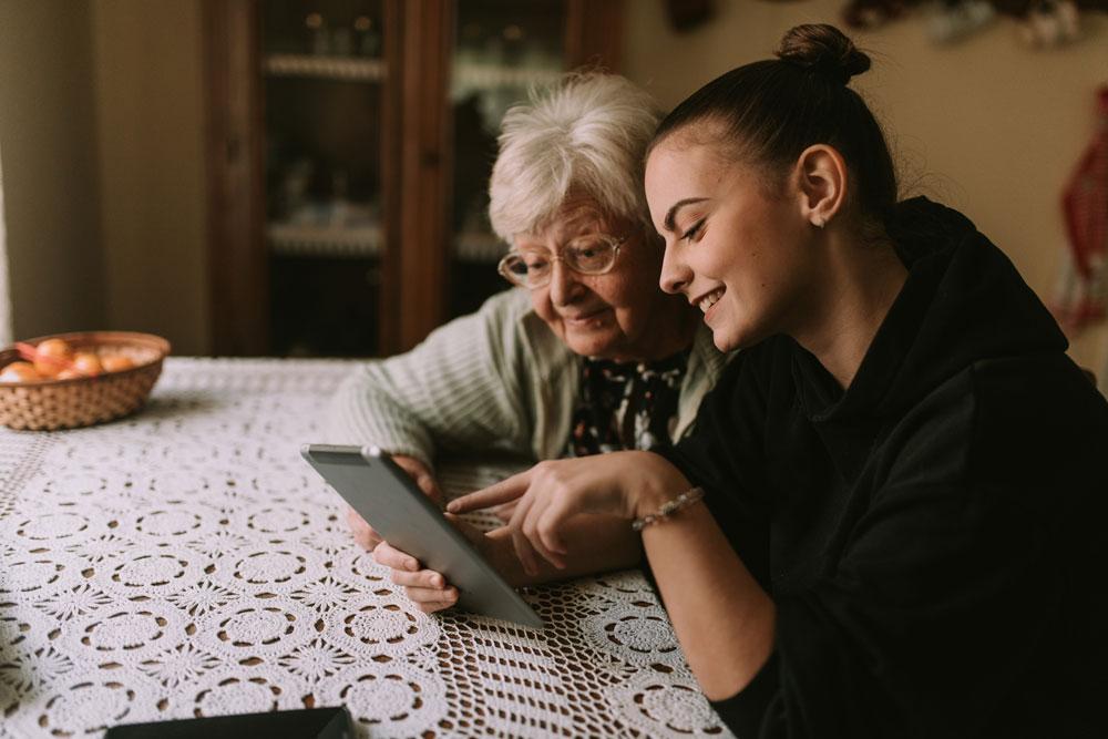 Two women looking at a tablet